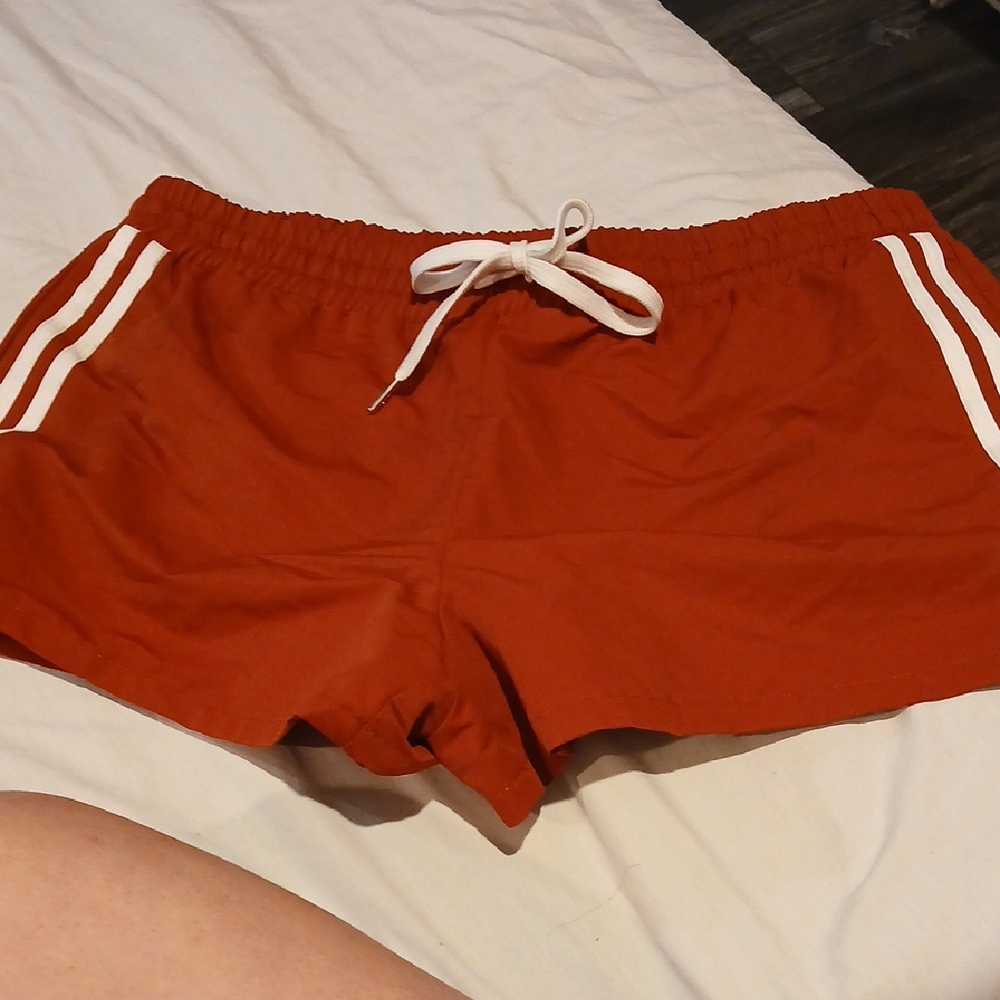 Vibrant Red Athletic Shorts with Adjustable Drawstring and Side Stripes